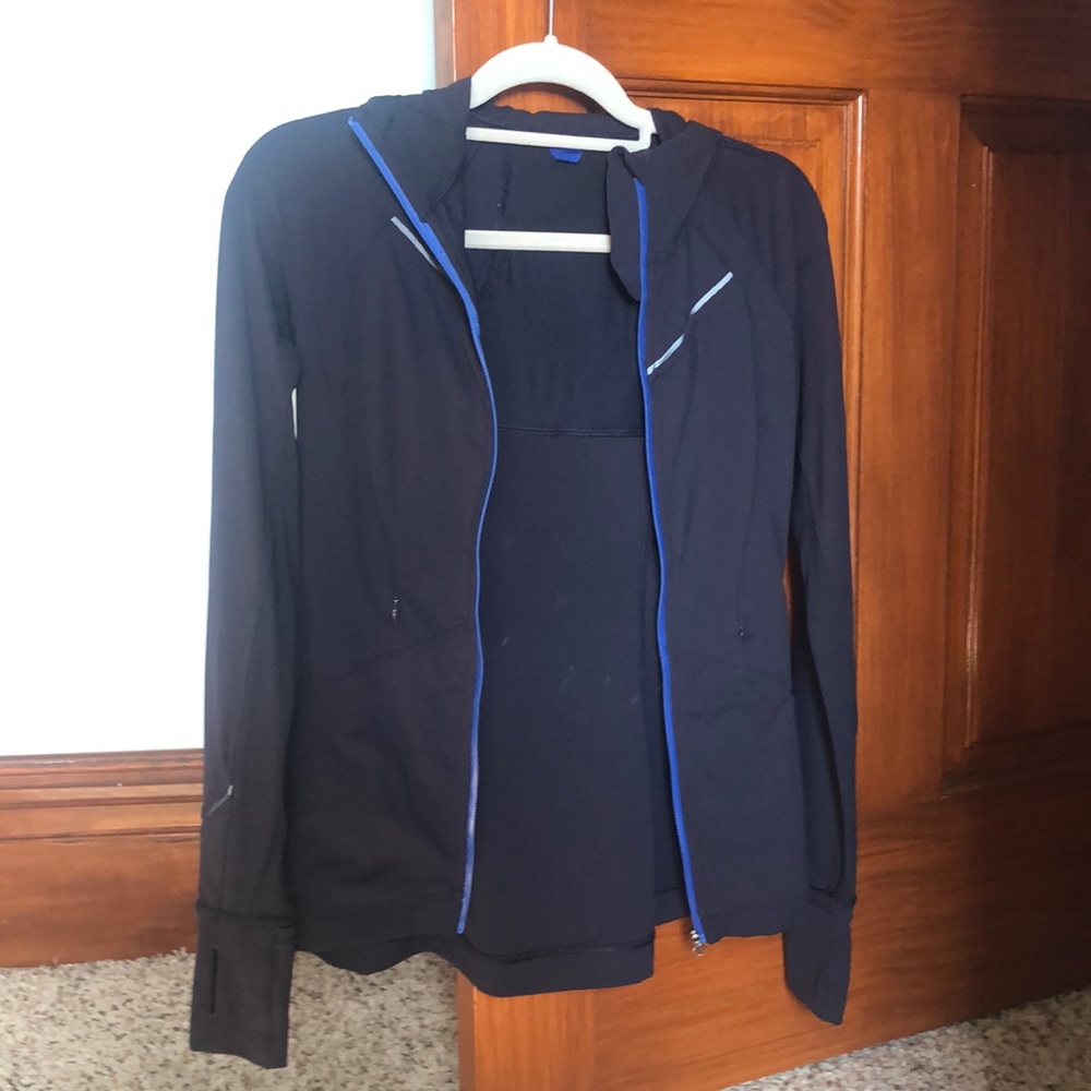 Worn once Lululemon Navy running jacket.Hood with pony tail slit Sleek fit